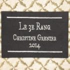 Detail of the piece of textile art The 3rd road. Embroidered label on the back with the title of the artwork, the name Christine Grenier and the date.