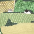 Detail of the piece of textile art The 3rd road. View of fields in the Appalachian Mountains as quilts.