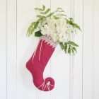 Elf stocking Princess Cyrielle garnished with a bouquet of white flowers.