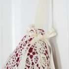 Detail of the Christmas stocking Princess Cyrielle, ivory ribbon bow with stone.
