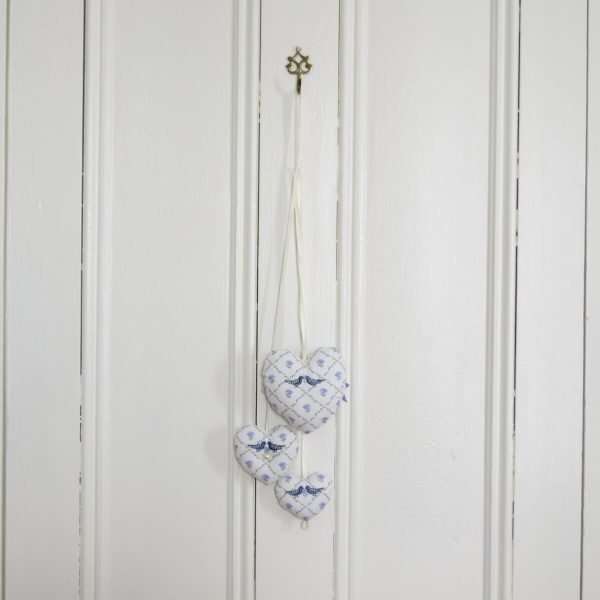 Trio of stuffed hearts in blue and white Laura Ashley fabric, embroidered with blue birds.