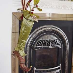 Christmas stocking Eldarion hanging on the fireplace.
