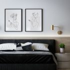 Black and white asymmetrical rectangular cushion on a bed