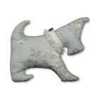 Green dog pillow with beige and brown flowers patterns