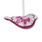 Oiseau à suspendre en tissu imprimé rose et turquoise sur fond blanc avec ventre en velours rose