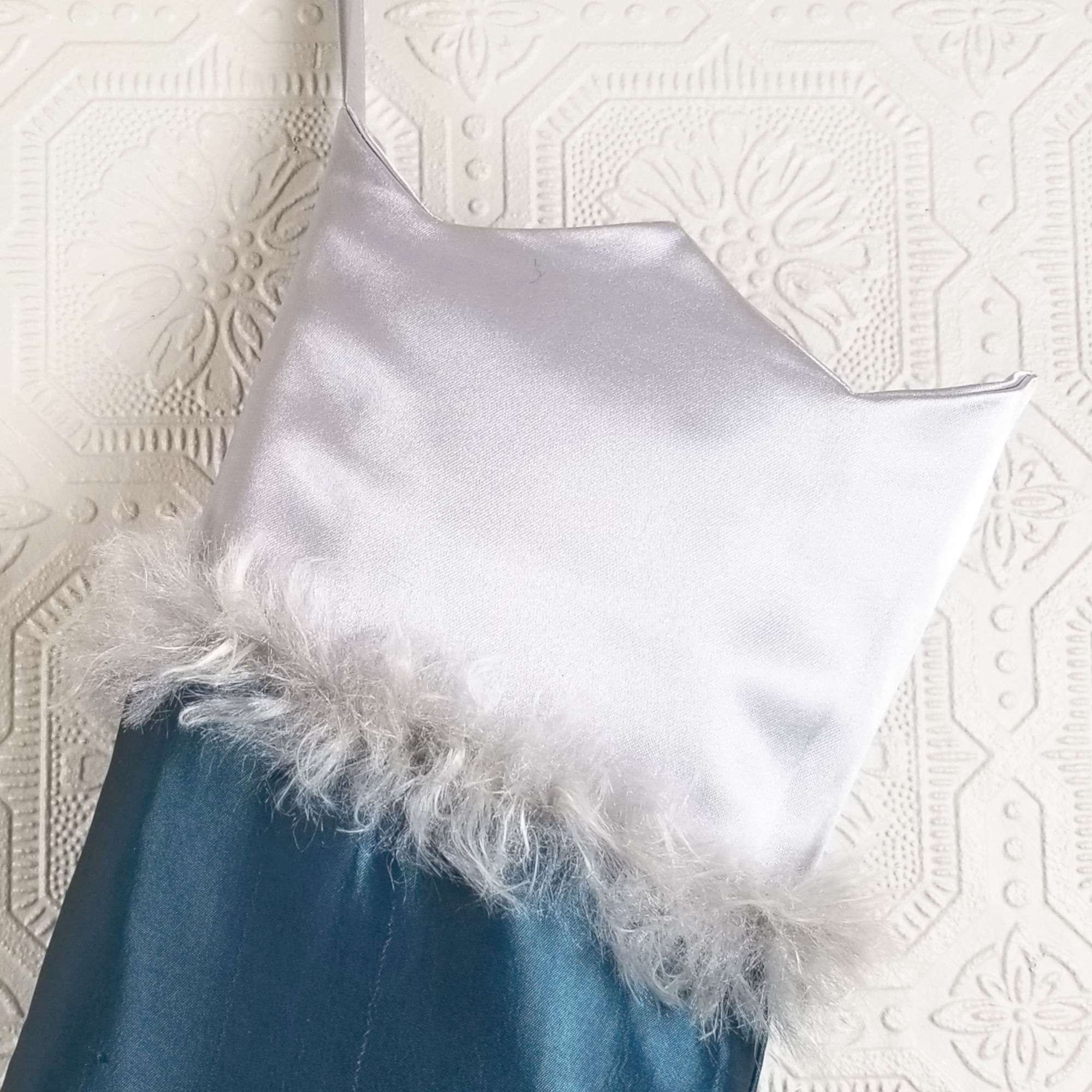 Crown shaped top of the Christmas stocking Comet, silver satin trimmed with silver fur