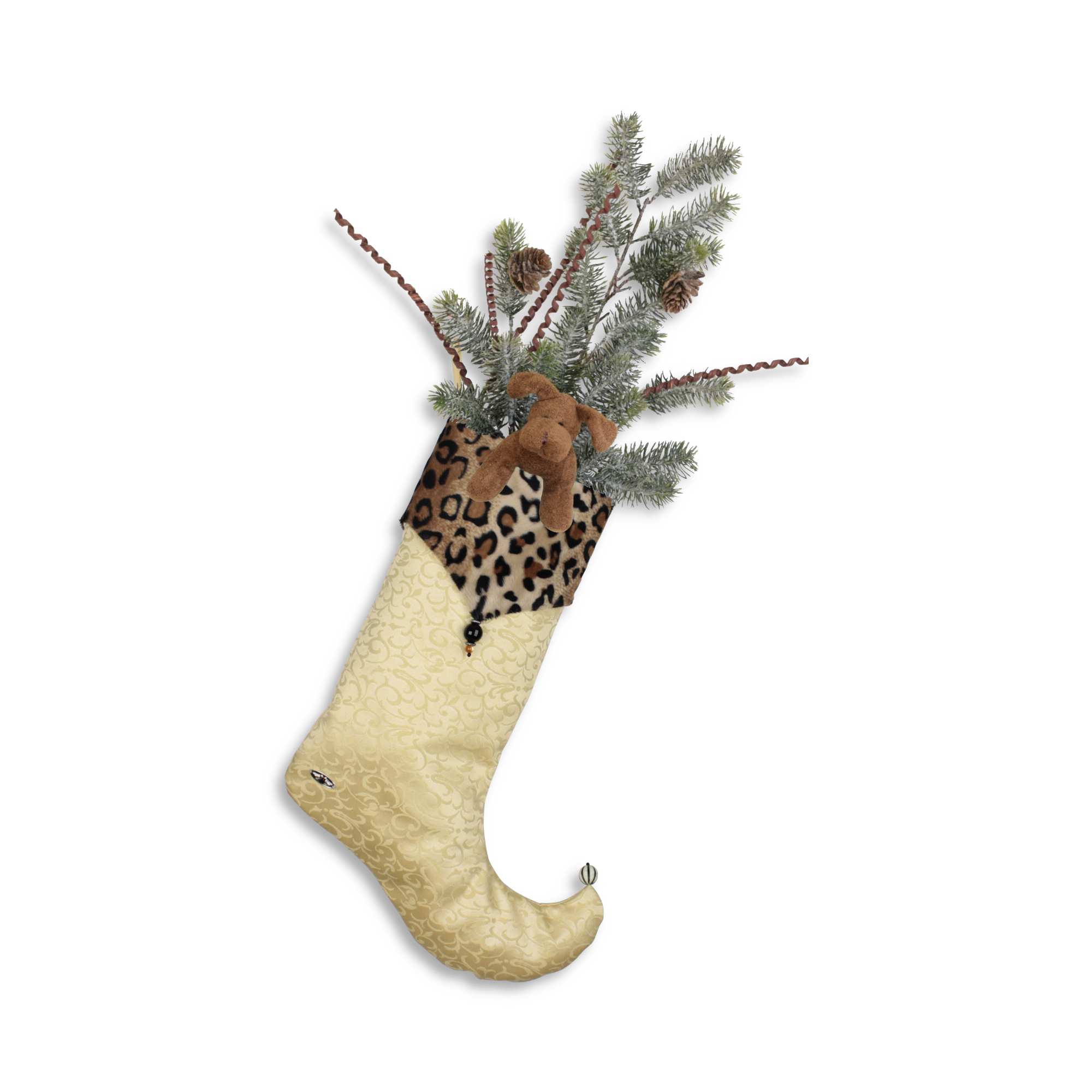 Bas de Noël Salomon décoré avec une peluche de chien et des branches de sapin et des cocottes.