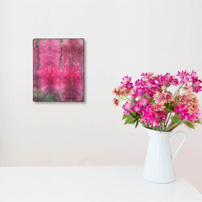 imitated pink flowers in white vase on white table